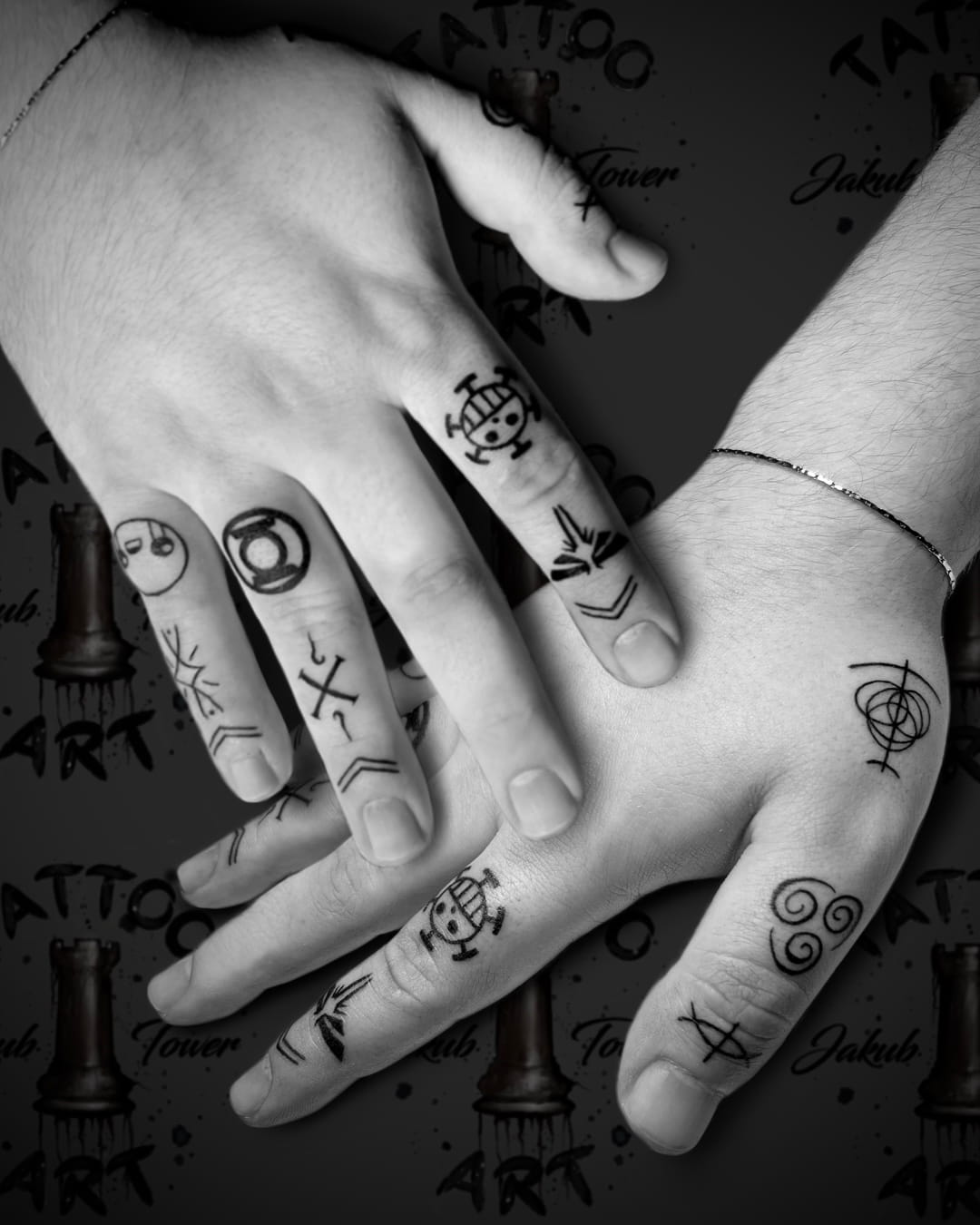 Hands with finger tattoos